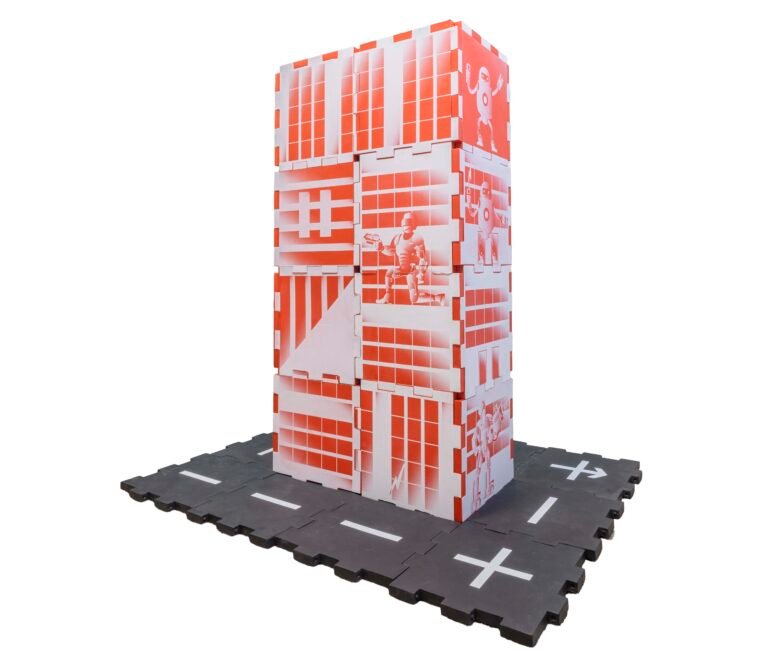Tall foam red tile building with battling robots and alien design and black streets encircling the base.
