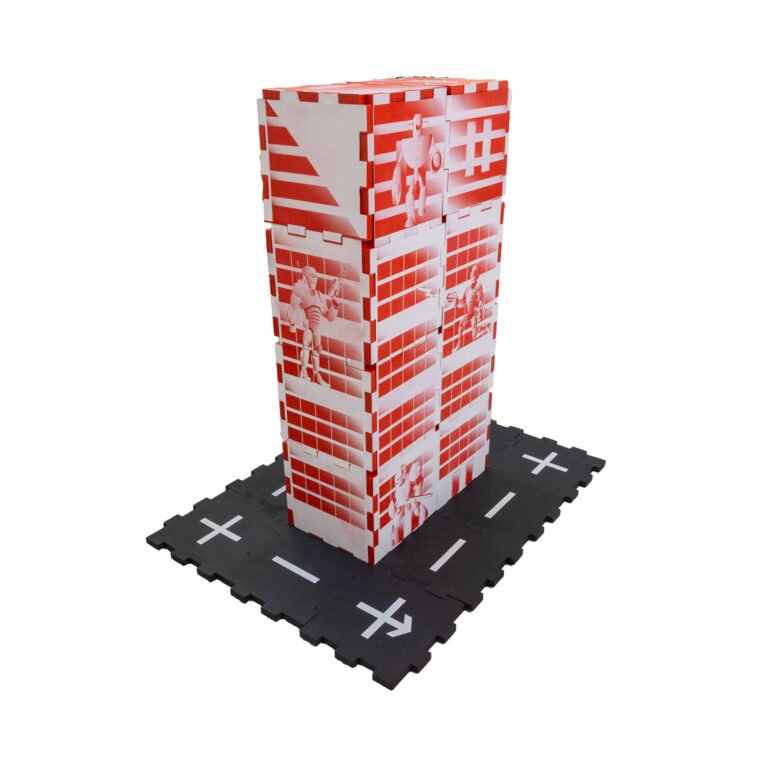 Red EVA foam tile building feature aliens and robots battling and black street tiles at the base.