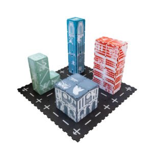Complete Rampage City EVA foam tile city with train station, factory, battle building and tower and black street tiles at the base.
